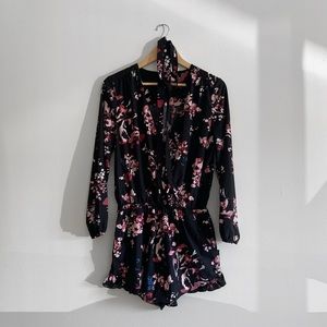 Floral romper with long sleeves and v neckline